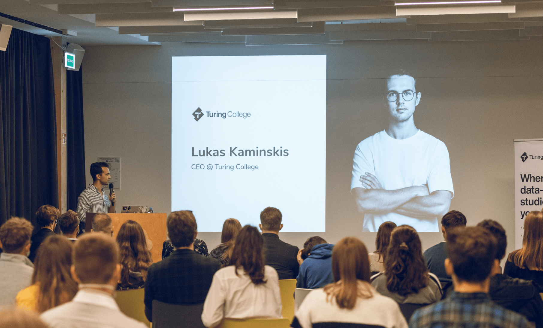 Lukas Kaminskis talking in front of an audience