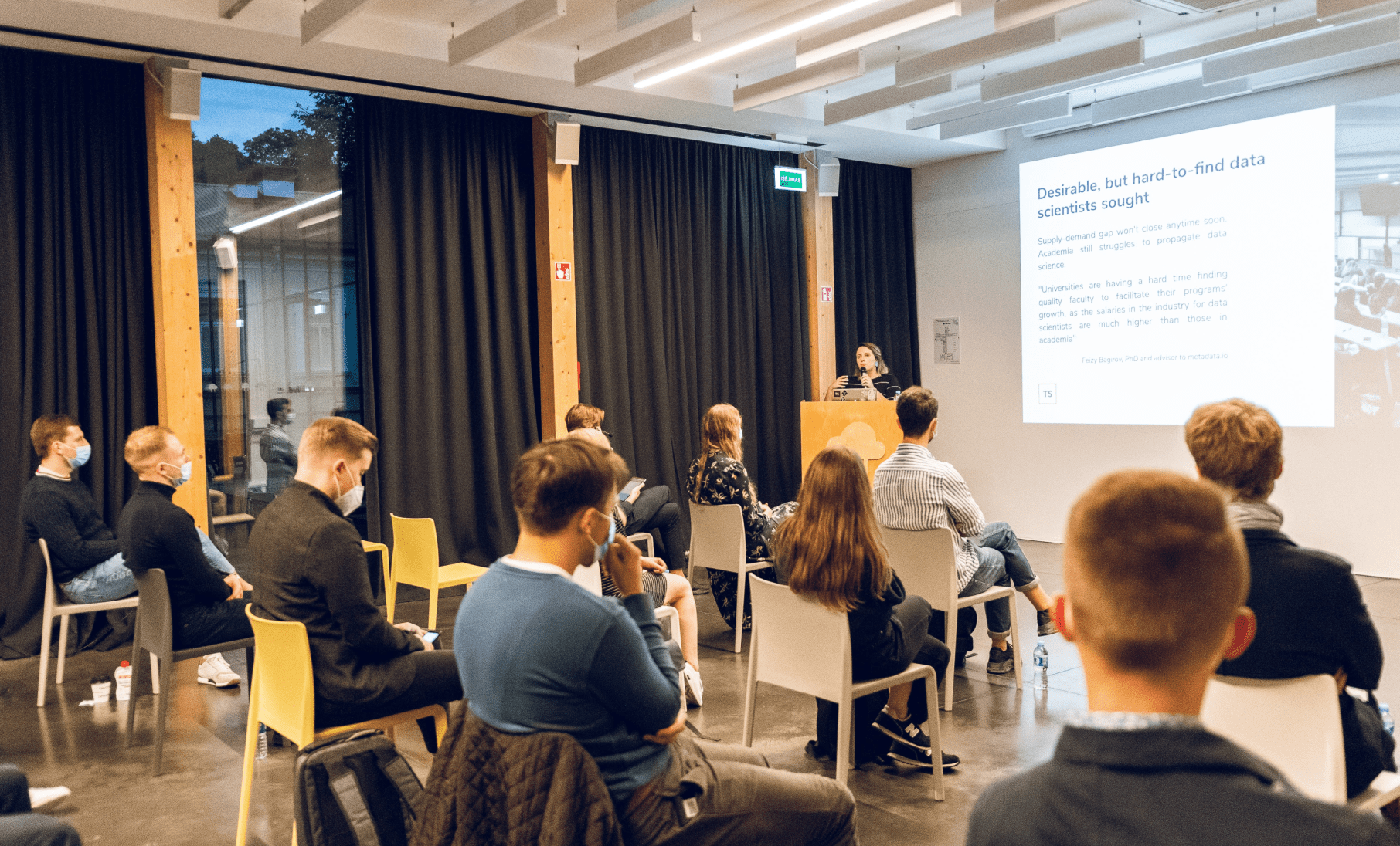 Monika Simaškaitė giving a talk about data scientist recruitment