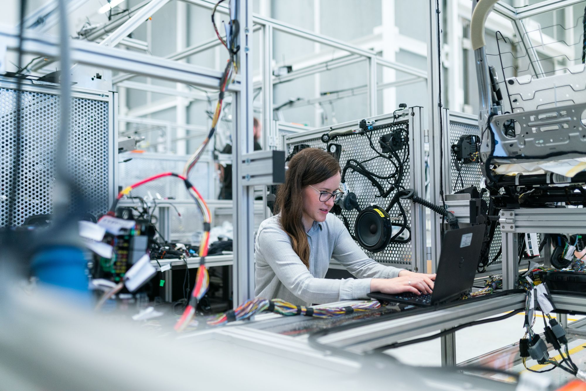 Woman working surrounded by hardware