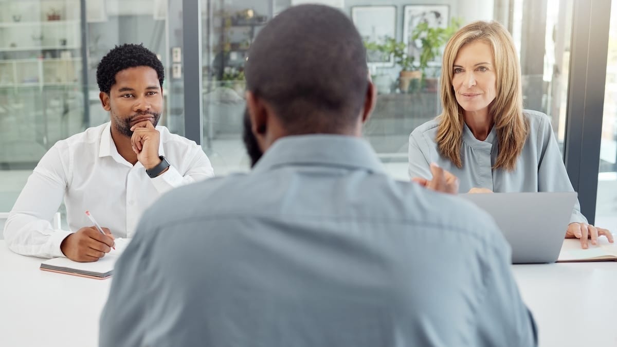 Two recruiters interviewing a job candidate