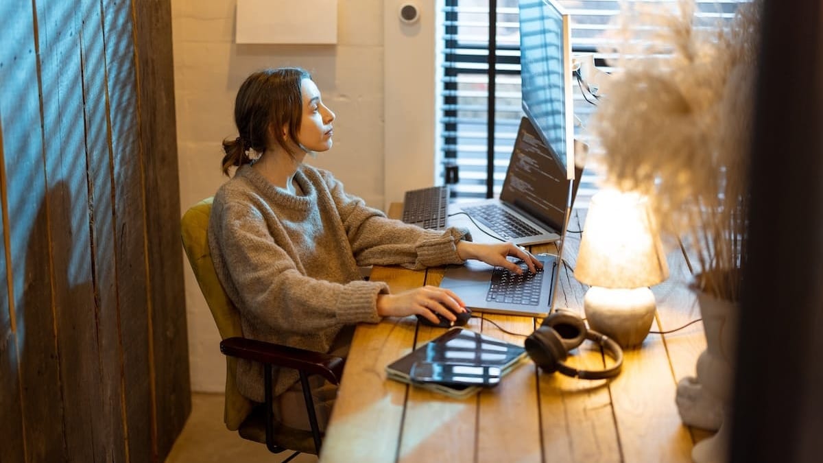 A woman working for a cozy home office